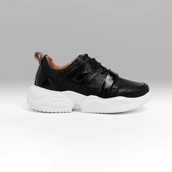 Sneakers Vitti Madrid. This sneaker is an epitome of urban sophistication with its sleek black leather construction. TexturThis sneaker is an epitome of urban sophistication with its sleek black leather construction. Textur...