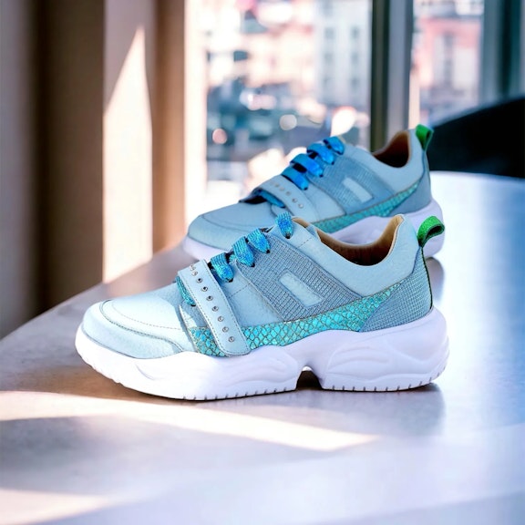 Sneakers Vitti Tenerife. This sneaker captivates with its pale blue leather construction, accented by sparkling turquoise lacThis sneaker captivates with its pale blue leather construction, accented by sparkling turquoise lac...