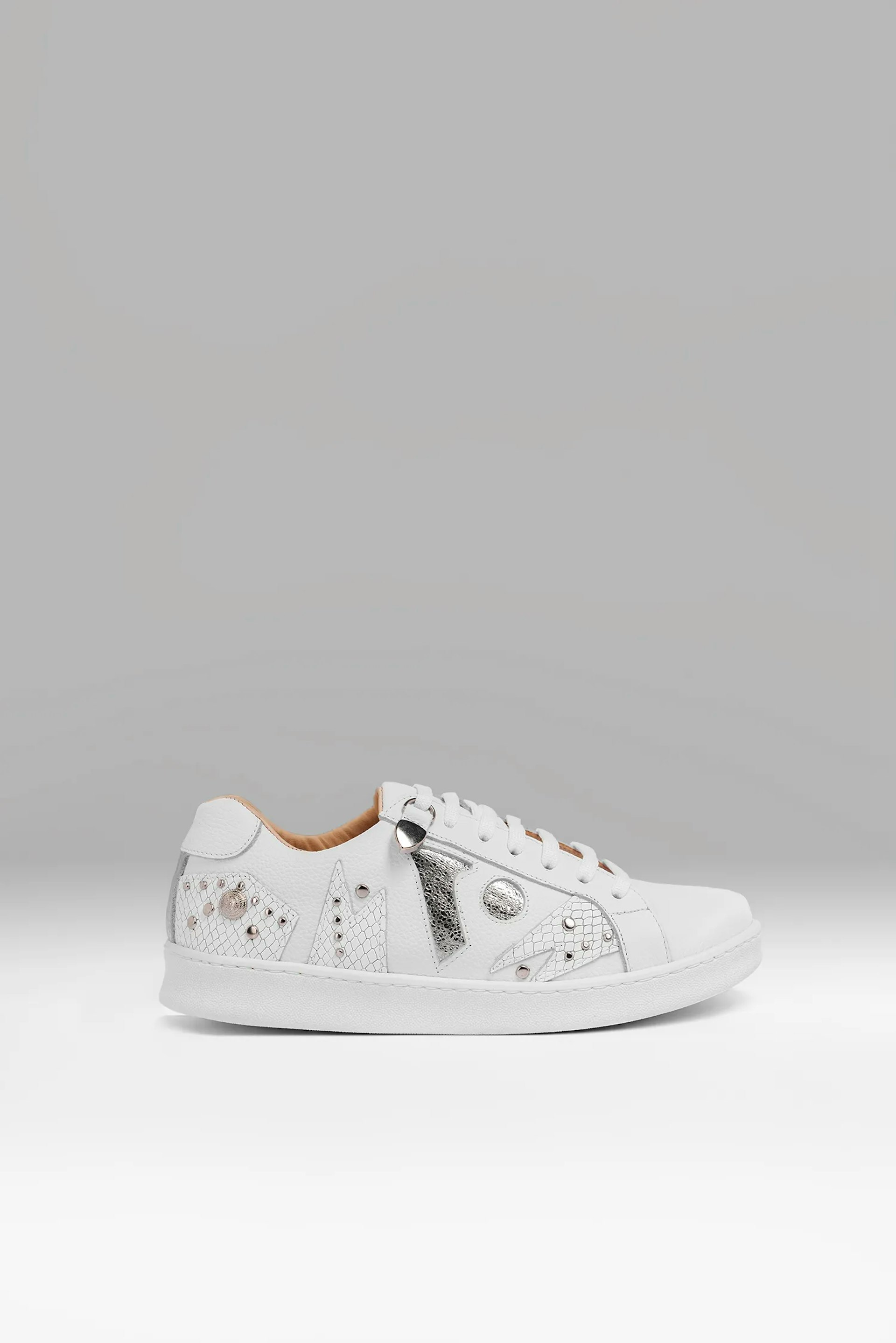 Sneakers Vitti Ibiza. White sneaker with tone-on-tone textured cutouts, silver studs, and the brand's logo in shiny silverWhite sneaker with tone-on-tone textured cutouts, silver studs, and the brand's logo in shiny silver...